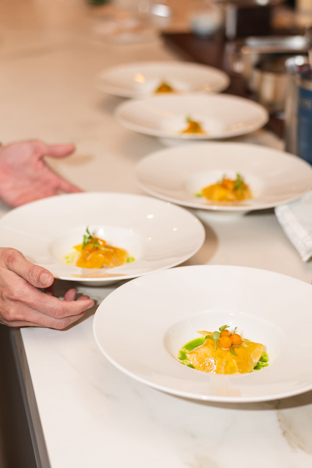 Chef Demonstrating Spiced Bulkan Banana Cake with Kalingag Cashew Mousse