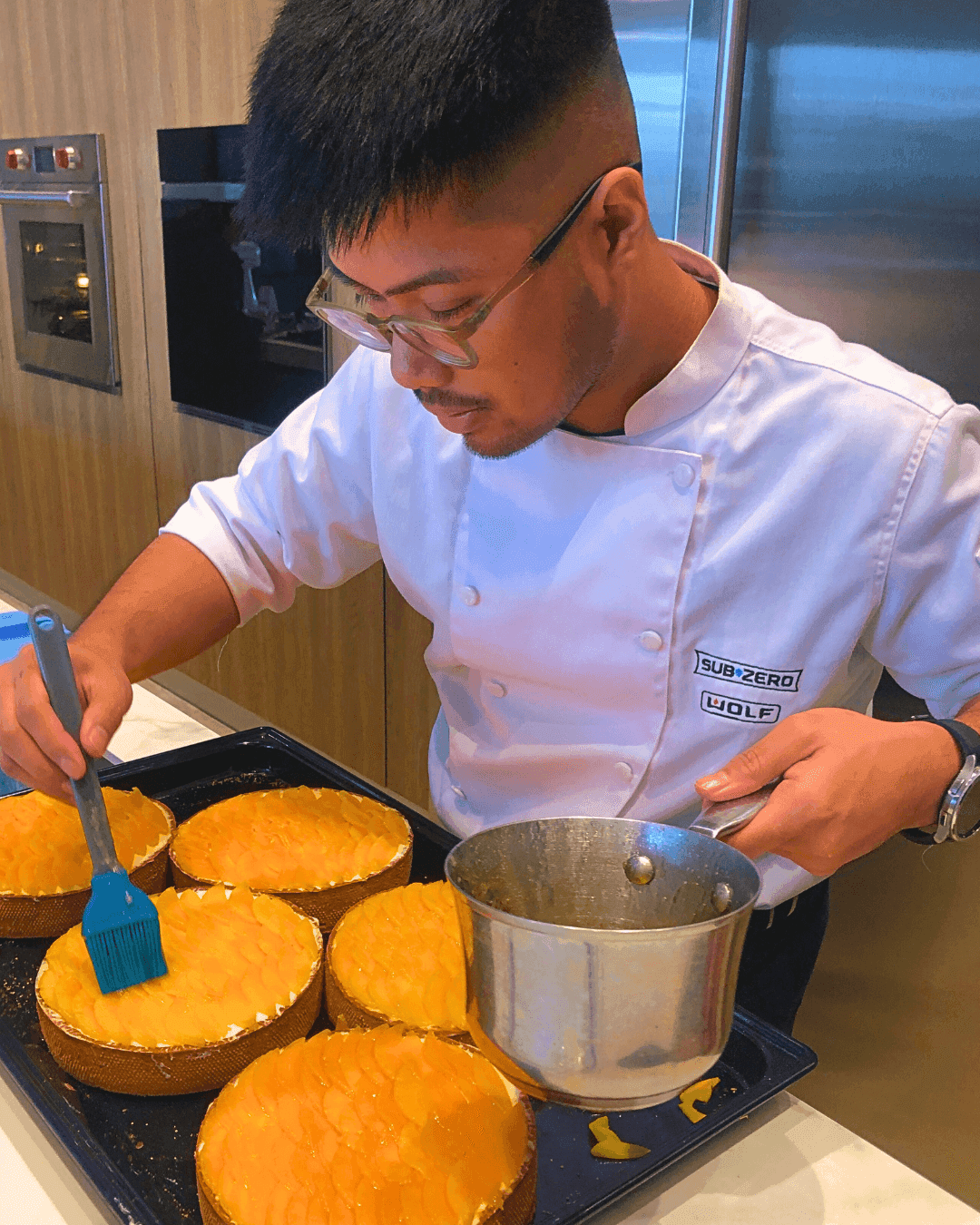 Chef Demonstrating Spiced Bulkan Banana Cake with Kalingag Cashew Mousse